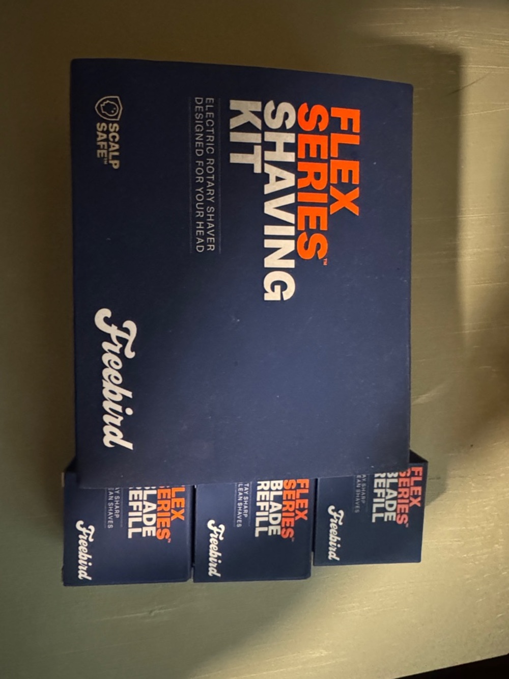 freebird Flex Series Shaving Kit in navy blue with orange accents 3 replacements